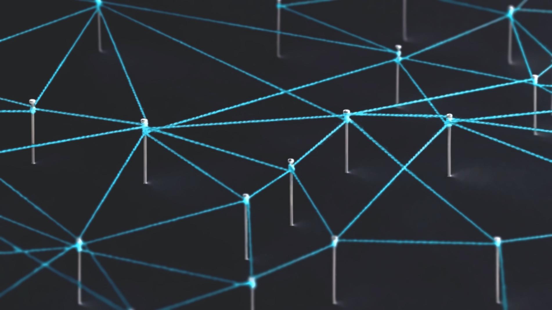 Students collaborating on decentralized network projects in modern classroom environment